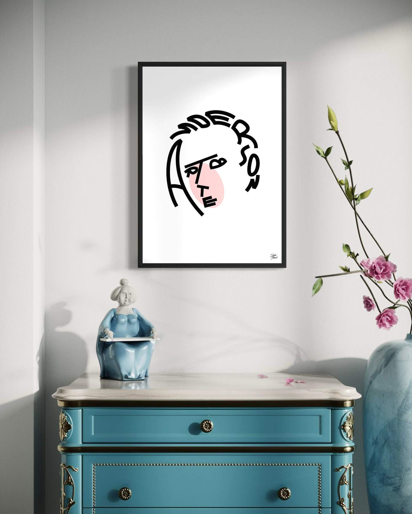 Framed artwork on a wall above a blue dresser with decorative items.